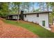 Painted brick home with a wooden deck overlooking a sloping green yard, blending comfort with outdoor charm at 2228 Old Dallas Sw Rd, Marietta, GA 30064