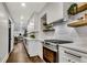 Bright kitchen features stainless steel appliances, white cabinets and decorative floating shelves at 2228 Old Dallas Sw Rd, Marietta, GA 30064