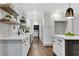 Bright kitchen features white cabinets, stainless steel appliances and decorative floating shelves at 2228 Old Dallas Sw Rd, Marietta, GA 30064