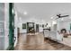 Inviting open-concept living room features hardwood floors, fireplace, and seamlessly connects to the kitchen at 2228 Old Dallas Sw Rd, Marietta, GA 30064