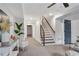 Comfortable living room with carpet, stairs, and a blue accent wall at 2228 Old Dallas Sw Rd, Marietta, GA 30064