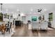 Spacious open concept living area with hardwood floors, white walls, an island, and eat-in kitchen area at 2228 Old Dallas Sw Rd, Marietta, GA 30064