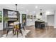 Bright living room with fireplace, wood floors, an island, and eat-in kitchen area at 2228 Old Dallas Sw Rd, Marietta, GA 30064