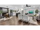 Open-concept living room features a fireplace, hardwood floors, island, and eat-in kitchen area at 2228 Old Dallas Sw Rd, Marietta, GA 30064
