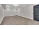 Spacious room featuring plush carpeting, neutral walls, and sleek trim, offering a blank canvas for personalization at 2228 Old Dallas Sw Rd, Marietta, GA 30064
