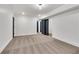 Carpeted room with white walls, dark doors, and trim, providing a versatile and modern space at 2228 Old Dallas Sw Rd, Marietta, GA 30064