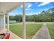 Relaxing backyard view from the porch, featuring a pool and storage sheds at 601 Wantland Rd, Bowdon, GA 30108