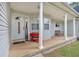 Charming front porch with white columns, seating, and decorative accents at 601 Wantland Rd, Bowdon, GA 30108