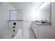 Bathroom with granite double vanity, shower, and soaking tub at 94 S Auburn Landing Pl, Auburn, GA 30011