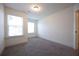Bright bedroom featuring carpet, large windows, and neutral walls at 94 S Auburn Landing Pl, Auburn, GA 30011