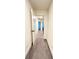 A long hallway with carpeted floors and doors to other rooms at 94 S Auburn Landing Pl, Auburn, GA 30011