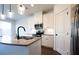 Modern kitchen features granite countertops, stainless steel appliances, and white cabinets at 94 S Auburn Landing Pl, Auburn, GA 30011
