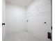 Laundry room with wire shelving and tile floor at 94 S Auburn Landing Pl, Auburn, GA 30011