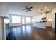 Spacious living room with fireplace and kitchen views at 94 S Auburn Landing Pl, Auburn, GA 30011