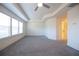 Main bedroom with carpeted floor, ceiling fan, and window at 94 S Auburn Landing Pl, Auburn, GA 30011