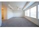 Main bedroom with carpeted floor, ceiling fan, and window at 94 S Auburn Landing Pl, Auburn, GA 30011