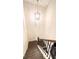 Modern staircase with dark wood steps and metal railing at 94 S Auburn Landing Pl, Auburn, GA 30011