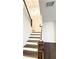 Elegant staircase with dark wood and metal railing at 94 S Auburn Landing Pl, Auburn, GA 30011