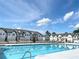 Community swimming pool with residential homes nearby at 94 S Auburn Landing Pl, Auburn, GA 30011