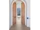 Elegant hallway with arched wood doors leading to another room at 3152 Woodrow Ne Way, Brookhaven, GA 30319