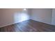 Spacious bedroom with wood-look floors and an exterior door at 3423 Glen Rd, Decatur, GA 30032