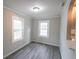 Light-filled dining area featuring hardwood floors and kitchen pass-through at 3423 Glen Rd, Decatur, GA 30032