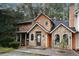 Beautiful townhouse with stone and wood exterior, featuring arched windows, a cozy entrance, and a well-maintained facade at 840 Brandy Oaks Ln, Stone Mountain, GA 30088