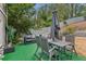 Enjoy this relaxing backyard featuring a patio set, a sofa, and a hammock at 1210 Swan Mill Ct, Suwanee, GA 30024