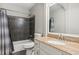 Full bathroom with granite countertop, shower/tub combo, and decorative tiling at 1210 Swan Mill Ct, Suwanee, GA 30024