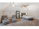 This spacious bedroom features a cozy sitting area, large mirror, and unique light fixtures at 1210 Swan Mill Ct, Suwanee, GA 30024