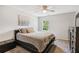 Cozy bedroom with neutral tones, natural light, carpet, and a ceiling fan at 1210 Swan Mill Ct, Suwanee, GA 30024
