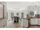 Bright kitchen features a cozy breakfast nook with large windows offering a picturesque view at 1210 Swan Mill Ct, Suwanee, GA 30024