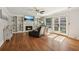 Inviting living room with built-in shelves, a fireplace, and french doors to the backyard at 1210 Swan Mill Ct, Suwanee, GA 30024