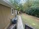 The backyard has a small shed with an AC unit next to the house at 32 Sherwood Loop, Mcdonough, GA 30253