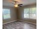 Empty bedroom featuring hardwood floors, natural light, and fresh paint at 32 Sherwood Loop, Mcdonough, GA 30253