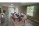 Dining room with table and seating for six, neutral walls, and patio door at 32 Sherwood Loop, Mcdonough, GA 30253