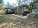 This home has brown siding, an AC unit and a deck with stairs in the fenced-in backyard at 32 Sherwood Loop, Mcdonough, GA 30253