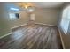 Open-concept living room showing wood-look floors, natural light, and fresh paint at 32 Sherwood Loop, Mcdonough, GA 30253