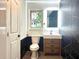 Stylish bathroom with marble accents, a vanity, and modern fixtures at 246 Plantation Sw Rd, Smyrna, GA 30082