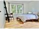 Bedroom boasting lots of natural light, hardwood floors, and contemporary decor at 246 Plantation Sw Rd, Smyrna, GA 30082