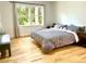 Bedroom with hardwood floors, two large windows, and natural light at 246 Plantation Sw Rd, Smyrna, GA 30082