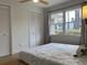 Bedroom featuring hardwood floors, natural light, and double closets for ample storage at 246 Plantation Sw Rd, Smyrna, GA 30082