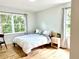 Bedroom with an airy feel, large windows, and gleaming hardwood floors at 246 Plantation Sw Rd, Smyrna, GA 30082