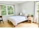 Bright bedroom with hardwood floors, a large window, and simple, modern decor at 246 Plantation Sw Rd, Smyrna, GA 30082