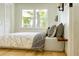 Comfortable bedroom with large window, soft lighting, and minimalist decor at 246 Plantation Sw Rd, Smyrna, GA 30082
