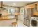 Modern kitchen featuring stainless steel appliances, butcher block countertops, and white cabinets at 246 Plantation Sw Rd, Smyrna, GA 30082