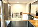 Open kitchen with wood countertops, stainless steel appliances, and eat-in dining area at 246 Plantation Sw Rd, Smyrna, GA 30082