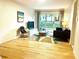 Living room with hardwood floors, slider doors, and neutral decor at 246 Plantation Sw Rd, Smyrna, GA 30082