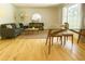 Bright living room with hardwood floors, a couch, and a large window providing lots of natural light at 246 Plantation Sw Rd, Smyrna, GA 30082