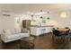 Open-concept living space with a modern kitchen, comfortable seating, and stylish lighting fixtures at 246 Plantation Sw Rd, Smyrna, GA 30082